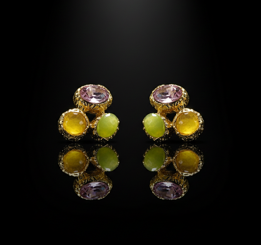 Pair of earrings with multicolored gemstones on a black background