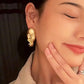 Golden Silence Face Statement Earrings