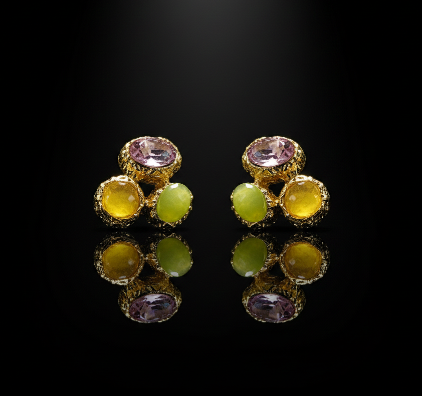 Pair of earrings with multicolored gemstones on a black background
